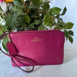 Coach EUC hot pink leather corner zip wristlet